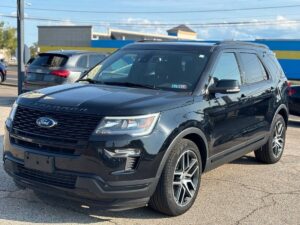 2018 Ford Explorer showcasing key features: spacious interior, advanced safety technology, powerful engine, and sleek exterior design.