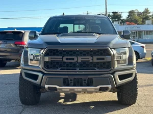 2020 Ford F-150 driving on a rugged road, showcasing its powerful performance and sleek design.