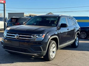 2019 Volkswagen Atlas parked in a scenic outdoor setting, showcasing its spacious design and modern features.