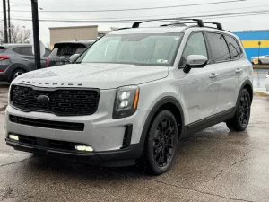 The 2021 Kia Telluride parked outdoors, highlighting its striking exterior design, signature grille, and premium LED headlights.