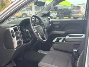 A 2018 Chevrolet Silverado 1500 showcasing its bold design, sturdy build, and sleek detailing under natural lighting.