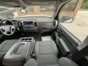 A 2018 Chevrolet Silverado 1500 showcasing its bold design, sturdy build, and sleek detailing under natural lighting.