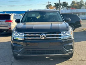 2019 Volkswagen Atlas parked in a scenic outdoor setting, showcasing its spacious design and modern features.