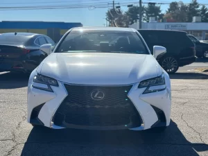 A sleek 2019 Lexus GS 350 sedan parked on a scenic road, showcasing its luxury design and modern features.