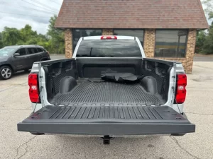 A 2018 Chevrolet Silverado 1500 showcasing its bold design, sturdy build, and sleek detailing under natural lighting.