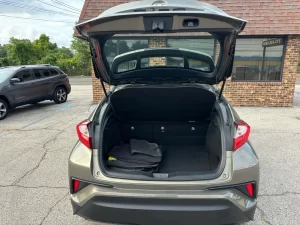 The 2021 Toyota C-HR LE showcases a sleek design with modern lines and refined details, highlighting its stylish and dynamic appeal.