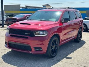 2019 Dodge Durango showcasing bold front grille, sleek body design, LED headlights, and spacious interior with advanced dashboard features.