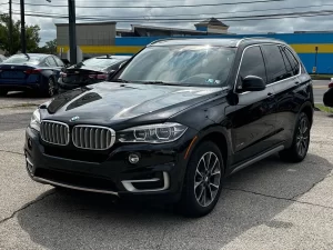 A sleek 2018 BMW X5 showcasing its premium design, elegant contours, and dynamic stance, highlighting its luxury and performance.