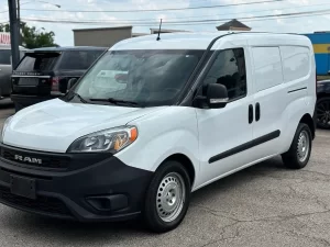 2021 RAM ProMaster City Tradesman parked outdoors, showcasing its sleek design and compact build for versatile business use.