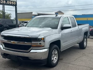 A 2018 Chevrolet Silverado 1500 showcasing its bold design, sturdy build, and sleek detailing under natural lighting.