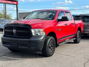 2016 RAM 1500 Express showcasing its robust design and bold style in a scenic outdoor setting.