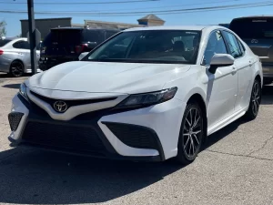 2021 Toyota Camry SE in a sleek design, showcasing its modern styling and bold appearance.