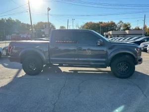 2020 Ford F-150 driving on a rugged road, showcasing its powerful performance and sleek design.