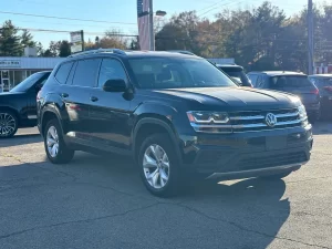 2019 Volkswagen Atlas parked in a scenic outdoor setting, showcasing its spacious design and modern features.