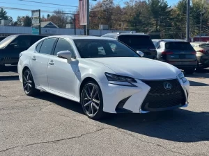 A sleek 2019 Lexus GS 350 sedan parked on a scenic road, showcasing its luxury design and modern features.