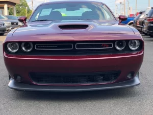 The 2021 Dodge Challenger in a sleek, dynamic pose showcasing its bold design and powerful stance.