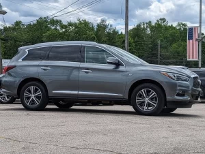 A sleek and stylish 2020 INFINITI QX60 SUV in a sophisticated setting, showcasing its premium design and elegance.