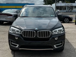 A sleek 2018 BMW X5 showcasing its premium design, elegant contours, and dynamic stance, highlighting its luxury and performance.