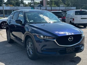 The 2017 Mazda CX-5 Touring AWD SUV showcases its sleek design, refined interior, and advanced features for a smooth driving experience.