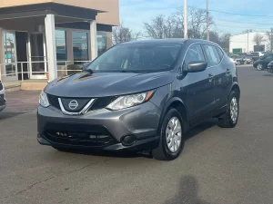 A 2019 Nissan Rogue Sport S AWD 4dr Crossover in a dynamic setting, showcasing its sleek design, advanced features, and modern appeal.