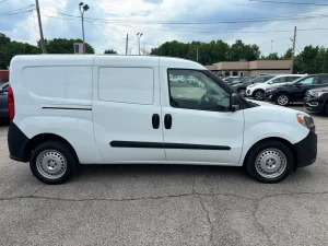 2021 RAM ProMaster City Tradesman parked outdoors, showcasing its sleek design and compact build for versatile business use.