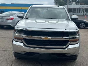 A 2018 Chevrolet Silverado 1500 showcasing its bold design, sturdy build, and sleek detailing under natural lighting.