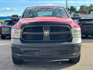 2016 RAM 1500 Express showcasing its robust design and bold style in a scenic outdoor setting.