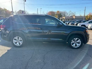 2019 Volkswagen Atlas parked in a scenic outdoor setting, showcasing its spacious design and modern features.