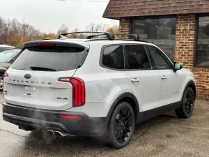 The 2021 Kia Telluride parked outdoors, highlighting its striking exterior design, signature grille, and premium LED headlights.