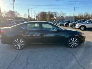 2019 Nissan Altima parked outdoors, highlighting its aerodynamic curves and contemporary styling.