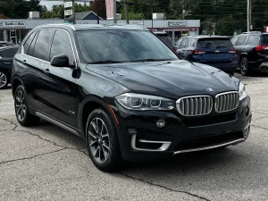 A sleek 2018 BMW X5 showcasing its premium design, elegant contours, and dynamic stance, highlighting its luxury and performance.