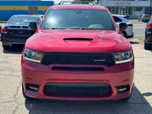 2019 Dodge Durango showcasing bold front grille, sleek body design, LED headlights, and spacious interior with advanced dashboard features.