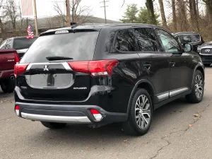 The 2018 Mitsubishi Outlander ES 4dr SUV showcasing its sleek design, spacious interior, and modern features, perfect for family adventures.