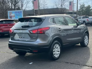 A 2019 Nissan Rogue Sport S AWD 4dr Crossover in a dynamic setting, showcasing its sleek design, advanced features, and modern appeal.