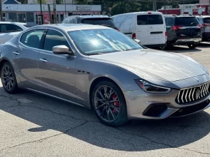 A sleek 2019 Maserati Ghibli SQ4 GranSport in gray, showcasing its elegant design, bold curves, and luxurious appeal against a clean background.