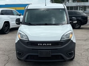 2021 RAM ProMaster City Tradesman parked outdoors, showcasing its sleek design and compact build for versatile business use.