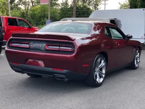 The 2021 Dodge Challenger in a sleek, dynamic pose showcasing its bold design and powerful stance.