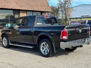 A 2017 RAM 1500 parked on an open road, showcasing its sleek design and rugged durability with a powerful presence.