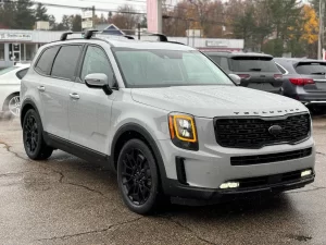 The 2021 Kia Telluride parked outdoors, highlighting its striking exterior design, signature grille, and premium LED headlights.