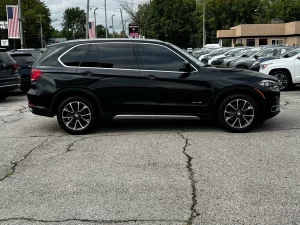 A sleek 2018 BMW X5 showcasing its premium design, elegant contours, and dynamic stance, highlighting its luxury and performance.