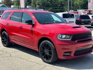 2019 Dodge Durango showcasing bold front grille, sleek body design, LED headlights, and spacious interior with advanced dashboard features.