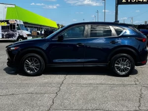 The 2017 Mazda CX-5 Touring AWD SUV showcases its sleek design, refined interior, and advanced features for a smooth driving experience.