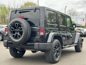 2017 Jeep Wrangler Unlimited SUV, 4WD with 3.6L V6 engine, 91,719 miles, black exterior and interior, 4 doors, financing available.