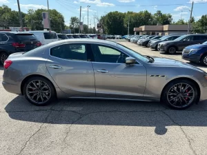 A sleek 2019 Maserati Ghibli SQ4 GranSport in gray, showcasing its elegant design, bold curves, and luxurious appeal against a clean background.