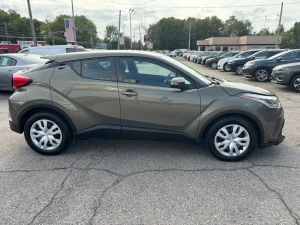 The 2021 Toyota C-HR LE showcases a sleek design with modern lines and refined details, highlighting its stylish and dynamic appeal.