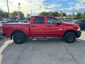 2016 RAM 1500 Express showcasing its robust design and bold style in a scenic outdoor setting.