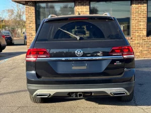 2019 Volkswagen Atlas parked in a scenic outdoor setting, showcasing its spacious design and modern features.