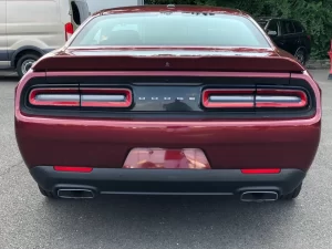 The 2021 Dodge Challenger in a sleek, dynamic pose showcasing its bold design and powerful stance.