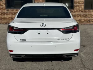 A sleek 2019 Lexus GS 350 sedan parked on a scenic road, showcasing its luxury design and modern features.