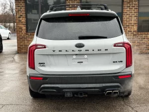 The 2021 Kia Telluride parked outdoors, highlighting its striking exterior design, signature grille, and premium LED headlights.